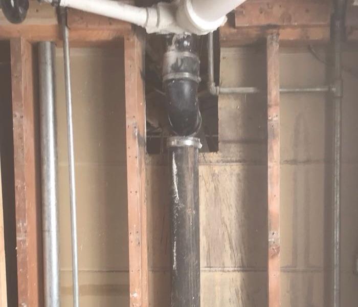 Water loss in a bathroom because of broken and leaky pipe