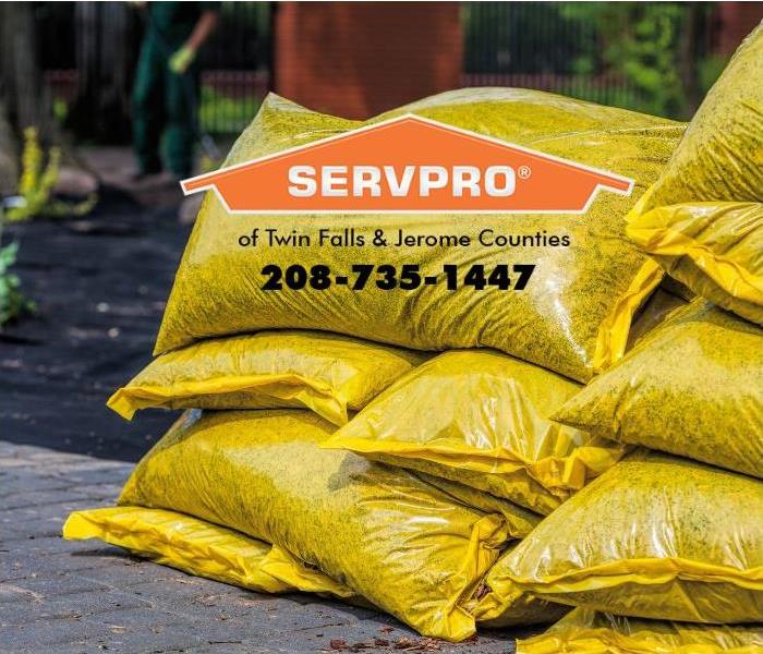 A stack of fertilizer bags is shown. 