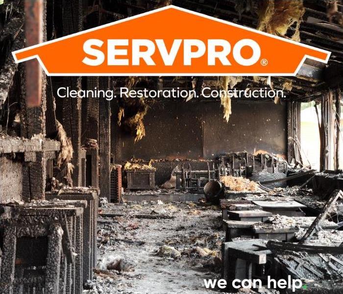SERVPRO logo on a photo of a burned building interior