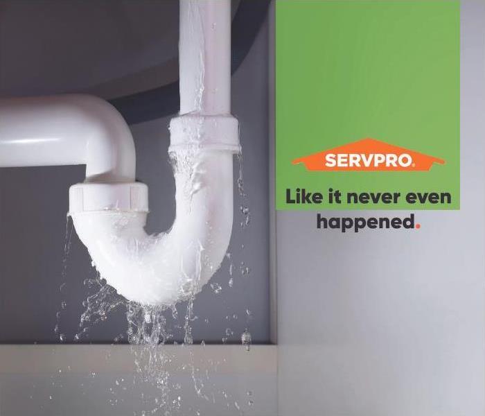 Pipe with water leaking with SERVPRO logo and text “Like it never even happened.”